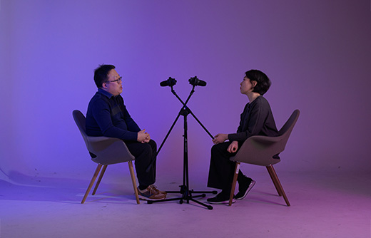 two-people-interviewing-on-a-violet-background
